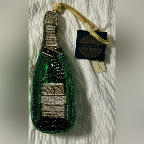 From India to you beaded champagne wristlet